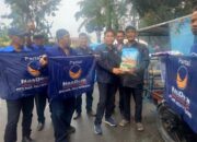 HUT Ke-11, DPD Partai NasDem DS Bagi Beras Kepada Tukang Becak