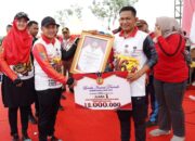 Bupati Zahir Bagi Sembako Dan Taburkan Bibit Ikan