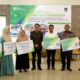 Kepala BPJS Kanca Tebingtinggi, Agus Sitinjak saat berfoto bersama seluruh tamu VIP yang berhadir. Waspada/Kristian Brahmana
