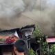 SEORANG warga melintasi kawasan rumah yagn terbakar di bantaran Sungai Deli, Jalan Badur, Kelurahan Hamdan, Kecamatan Medan Maimun, Kamis siang (10/8). Waspada/Ist
