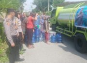 Polsek Percut Salurkan Air Bersih Kepada Warga Desa Sampali