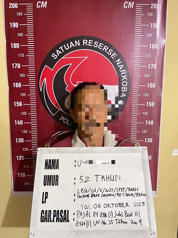 UH alias Man tersangka pemilik 180 gram ganja. Waspada/Ist