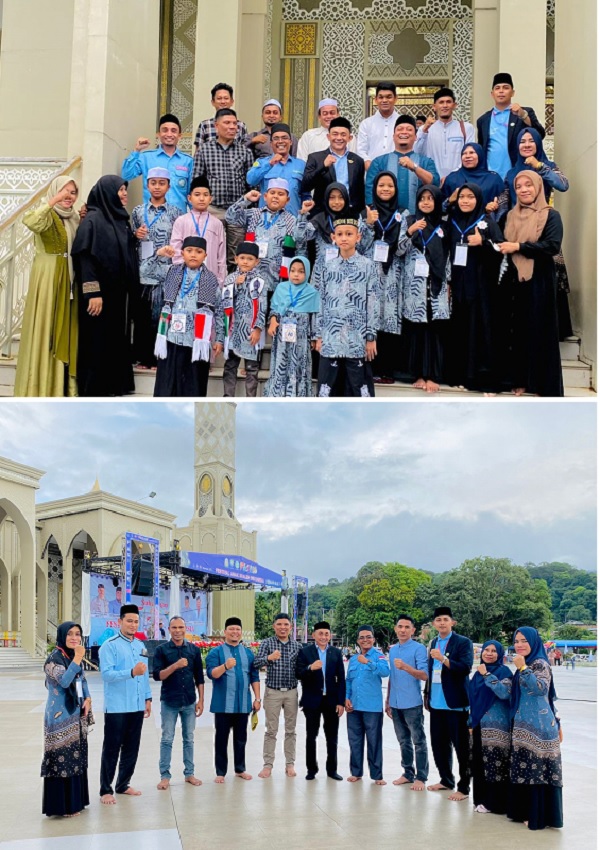 Nurdin A. Djalil, anggota DPRK Aceh Timur Fraksi Partai Aceh (PA) bersama tokoh pemuda berfoto dengan peserta dan official Kafilah FASI Aceh Timur di Masjid Agung Baitul Ghafur Blangpidie, Jumat (24/11). Waspada/H.Muhammad Ishak
