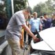 Walikota Medan Muhammad Bobby Afif Nasution melakukan pengisian baterai kendaraan listrik di Hotel Le Polonia (30/1).