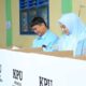 Bupati Labura Hendriyanto Sitorus bersama isteri dr.Rama Dhona Sihotang saat melakukan pencoblosan di TPS.03 Aek Kanopan, Kualuhhulu, Rabu (14/2). Waspada/ist