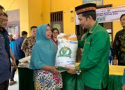 Pj Bupati Agara Serahkan Bantuan Beras