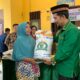 Pj Bupati Agara Serahkan Bantuan Beras