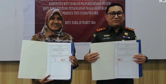   Penandatanganan Perjanjian Kesepahaman (MoU) Bapenda dan Dinas PMPTSP dengan Kejari Batubara. Waspada/Ist