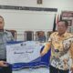   JALANNYA pelepasan Hamongan Saragih pegawai Lapas Kelas II-A Labuhan Ruku yang memasuki masa purna bakti.Waspada/Ist