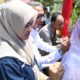 Asisten I Sekdakab Aceh Besar, Farhan AP, Kapolresta Banda Aceh, Kombespol Fahmi Irwan Ramli tandatangani MoU Gampong Cot Yang Bebas Narkoba di Halaman Meunasah Gampong Cot Yang, Kecamatan Kuta Baro, Aceh Besar, Rabu (3/4). (Waspada/Ist)