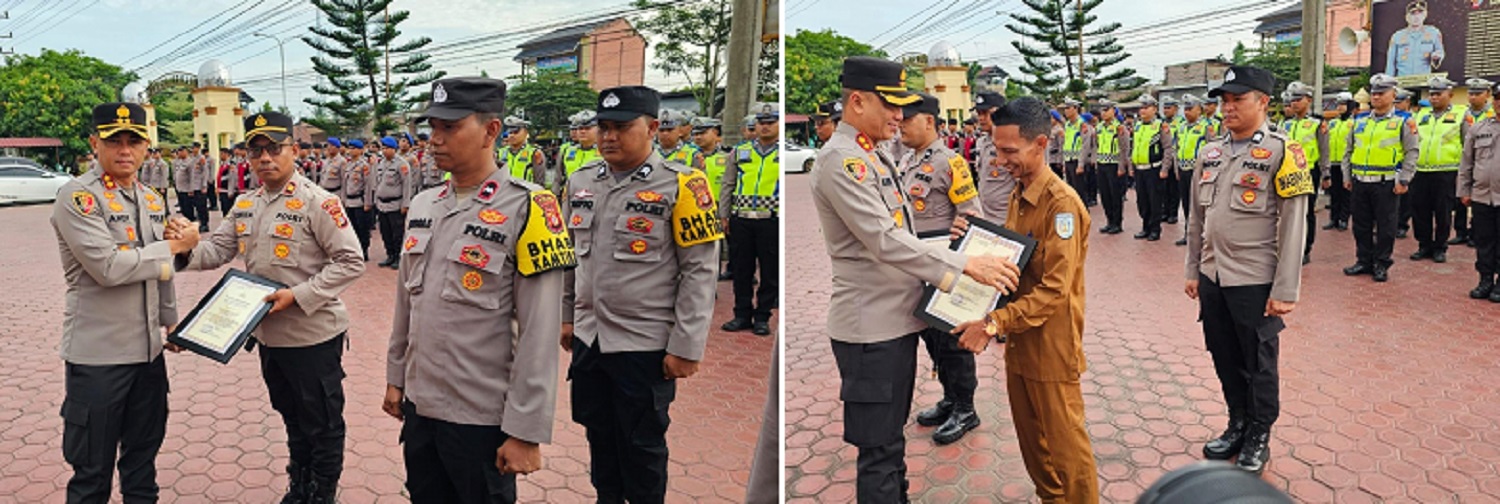Kapolres Langsa, AKBP Andy Rahmansyah, SIK, SH, MH memberikan penghargaan kepada Kapolsek Langsa Barat, Iptu Hufiza Fahmi, SH, MH dan personel atas keberhasilan dalam pengungkapan narkotika di Gp. S.Pauh Firdaus, Kec. Langsa Barat di lapangan apel Mapolres Langsa, Senin (27/5). Waspada/dede