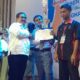 Nur Ilham Habibi menerima trophy Juara 1 LKS tingkat Provinsi Sumut dari Kepala Dinas Pendidikan Povsu Ir. Abdul Haris Lubis, M.Si.(Waspada/ist)