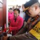 Ketua Umum Bhayangkari diwakili Ketua PD Bhayangkari Sumut, Ny. Ernie Agung Setia didampingi Kapolda Sumut, Irjen Pol. Agung Setya Imam Efendi saat pengguntingan pita Gereja Elim dan penyerahan kunci 10 unit rumah yang dibedah di Kabupaten Nias  Utara, Rabu (13/6).