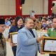 Bupati Tapanuli Selatan H Dolly Pasaribu saat meyerahkan Piagam penghargaan Kepada TPL yang diterima Manager TPL Sektor Tapsel Heddy Panjaitan.(Waspada/Ist)