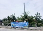 Dosen Unimed Memberikan Edukasi  Pemasangan Lampu Penerangan Jalan Umum Berbasis Tenaga Surya Di Desa Cinta Damai, Percut Seituan