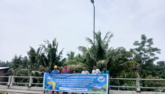 Dosen Unimed Memberikan Edukasi  Pemasangan Lampu Penerangan Jalan Umum Berbasis Tenaga Surya Di Desa Cinta Damai, Percut Seituan
