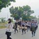 ATLET Drum Band Sumut yang akan bertanding di PON 2024, latihan di kawasan Jalan Arteri Kualanamu, Deli Serdang, Sabtu (3/8). Waspada/Ist