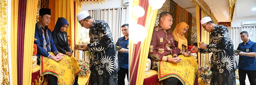 Ketua MPU Aceh Besar Tgk H Nasruddin M peusijuek Kapolres Aceh Besar, AKBP Sujoko, SIK, MH dan Ketua Pengadilan Negeri Jantho, Fadhli SH dalam acara malam penyambutan di Meuligoe Bupati Aceh Besar, di Kota Jantho, Sabtu (3/8) malam. (Waspada/Ist)