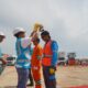 Direktur Distribusi PT (Persero), Adi Priyanto (dua dari kiri) bersama General Manager PLN UID Sumatera Utara, Saleh Siswanto (kiri) secara simbolis menyematkan rompi dan helm kepada petugas siaga PON XXI Aceh - Sumut 2024, Rabu (4/9).