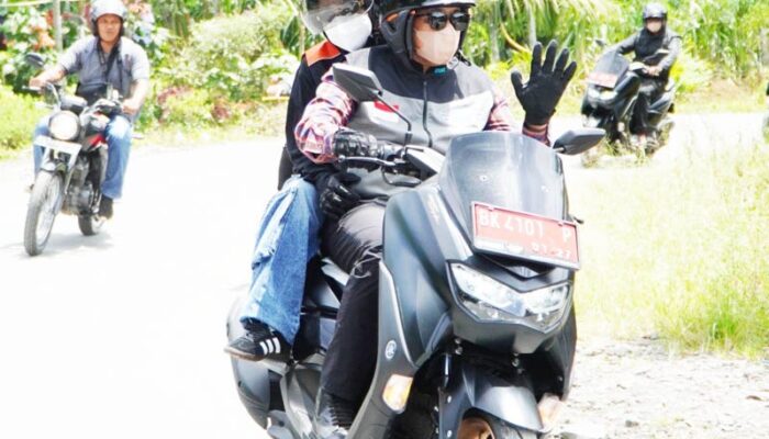 Pj Bupati Langkat Pantau Desa Dengan Sepeda Motor