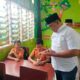 Saat Bantu Susu Gratis, M Dahnil Ginting Prihatin Halaman SDN Sampali Tergenang Air
