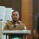 Asisten II Sekdakab Aceh Besar H.M Ali S.Sos M.Si membuka Gebyar Ramadhan Keuangan Syariah di Aula Kantor Bupati Aceh Besar, Kota Jantho, Selasa (18/3). (Waspada/Ist)