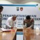 Penandatangan Perjanjian Kerjasama Teknis oleh Senior Manager Keuangan, Komunikasi dan Umum PLN UID Sumut, Efrom Lumpan Gaol (Kiri) bersama Direktur Pengamanan Objek Vital Nasional Kepolisian Daerah Sumatera Utara, Komisaris Besar Parhorian Lumban Gaol SH, S.I.K M Han(Kanan), Selasa (20/5).