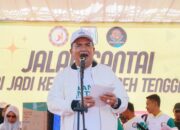 Silva Ramania Dan Siti Riana Raih Hadiah Utama Sepeda Motor Di Jalan Santai HUT Agara